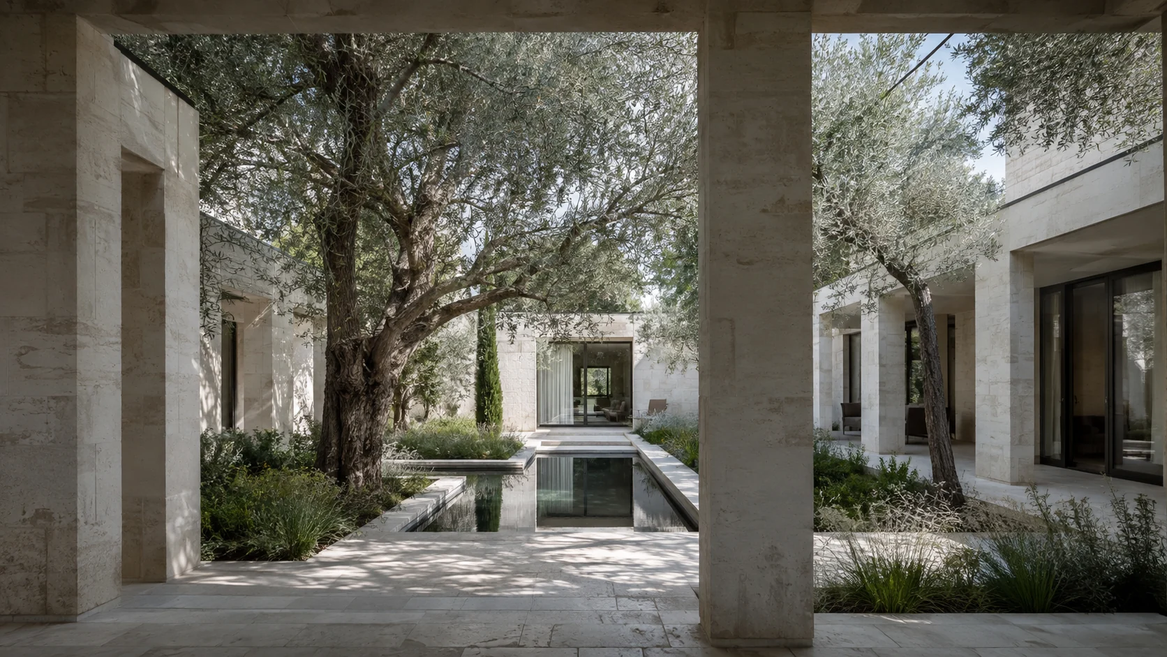 A limestone villa surrounding a mature olive garden